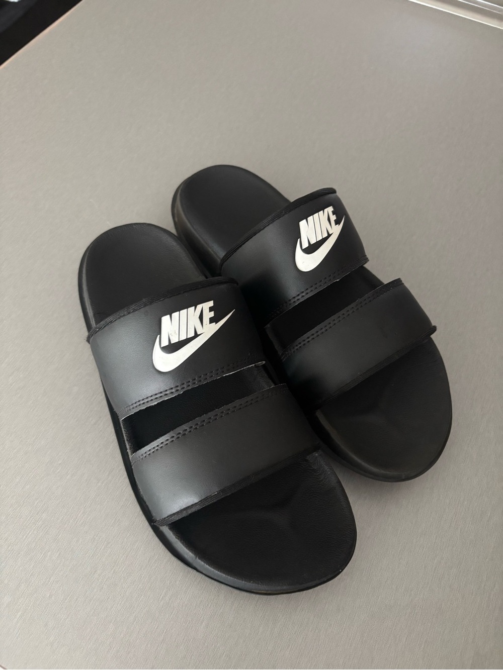 Nike Black Slide Sandals with White Swoosh Logo - Kids